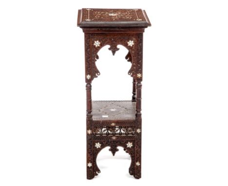 A 19TH CENTURY NORTH AFRICAN MOTHER-OF-PEARL INLAID TWO-TIER JARDINIERE STAND, with carved top and conforming lower shelf, an