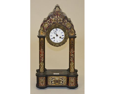 A FRENCH EMPIRE BOULLE STYLE PORTICO CLOCK, by Leroy of Paris, the shaped and arched top inlaid with etched bone, brass and f