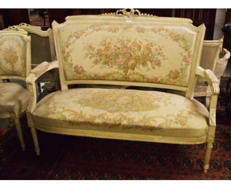 A THREE-PIECE FRENCH SUITE OF SEAT FURNITURE, comprising a pair of side chairs; a two seater settee with ribbon crest and pad