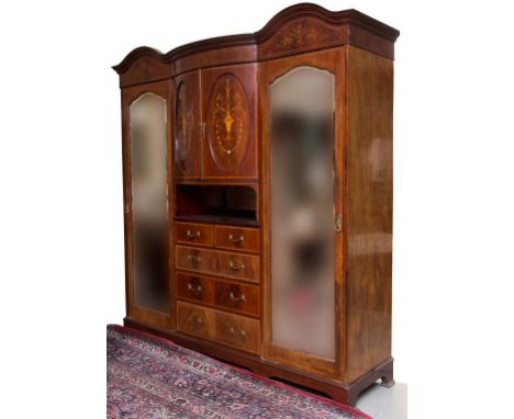 A LARGE EDWARDIAN INLAID AND CROSS-BANDED MAHOGANY WARDROBE, with double arch and bow-fronted cornice, above two bow-fronted 