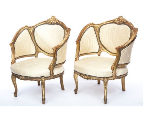 AN ATTRACTIVE PAIR OF LOUIS XV STYLE MOULDED GILT OCCASIONAL ARMCHAIRS, each with a triple-padded panel back and padded seat,