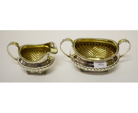 A GEORGE IV SILVER SUGAR AND CREAM, R. Pippin London 1825, the two-handled bowl with a gadroon edge and half-spiral reeded bo