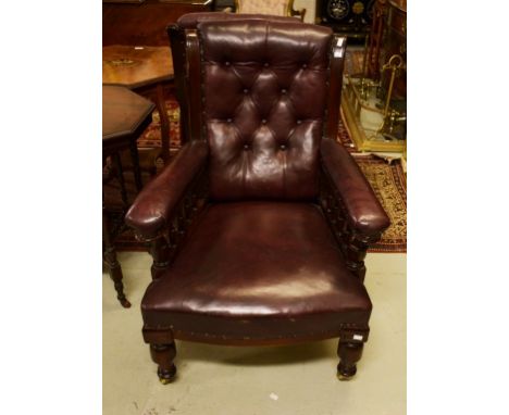 TWO SIMILAR VICTORIAN ARMCHAIRS, one walnut, the other oak, each with button-back and padded seat, raised on front turned leg
