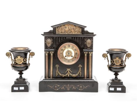 A HEAVY THREE -PIECE POLISHED BLACK LIMESTONE AND BRASS MOUNTED MANTEL CLOCK, late 19th century, of architectural design, the