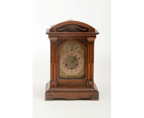 A WALNUT-CASED CHIMING BRACKET CLOCK, the circular dial with Arabic numerals and subsidiary dial for chime/silent and slow/fa