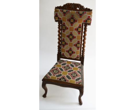 A VICTORIAN WALNUT PRIE DIEU, with leaf scroll crest, above a T-form padded panel, with bead tapestry and a conforming seat, 