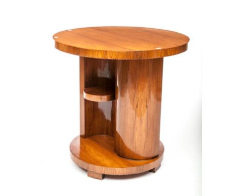 A CIRCULAR ART DECO STYLE WALNUT CENTRE TABLE, the shaped stem with a small shelf and raised on a circular plinth, 29.5" (75c