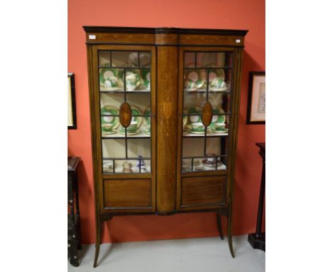 AN ATTRACTIVE EDWARDIAN INLAID MAHOGANY DISPLAY CABINET, with central bow front,  flanked to either side with a glazed door, 