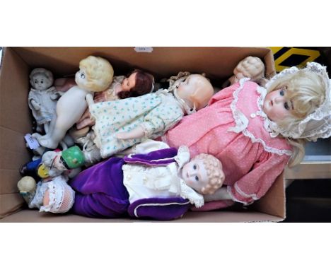 A COLLECTION OF BISQUE KEWPIE DOLLS, circa 1920s and others similar