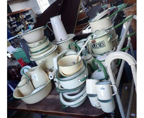 A LARGE COLLECTION OF VINTAGE CREAM AND GREEN ENAMEL KITCHENALIA