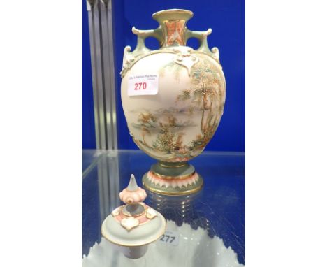 A BLUSH IVORY ROYAL WORCESTER VASE AND COVER with green raised decoration decorated with a landscape, 23.5cm high (inc lid)