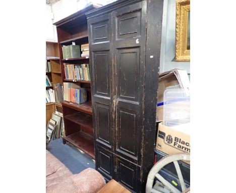 A GEORGE III FULL HEIGHT PINE CORNER CUPBOARD with original distressed brown painted finish on the outside, panel doors openi