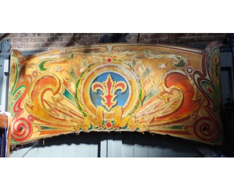 FAIRGROUND INTEREST; A 1930S ROUNDING BOARD BY FRED FOWLE, brightly decorated with old paintwork in gold red and blue on a ye