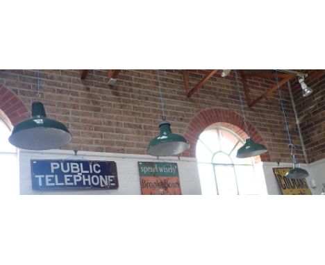 A COLLECTION OF VINTAGE GREEN ENAMEL SHADES (4)