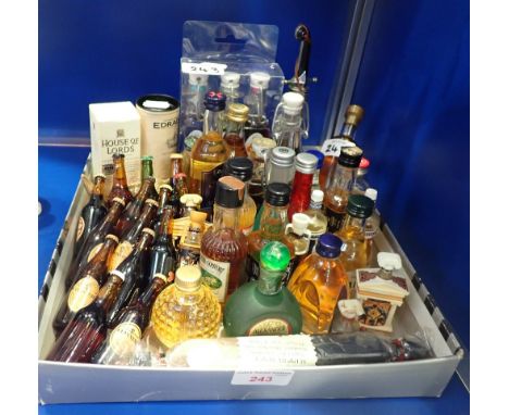 A COLLECTION OF VINTAGE MINIATURE GUINNESS BOTTLES and similar miniatures