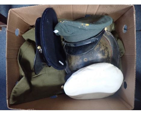 A COLLECTION OF MILITARIA, to include a tin helmet, caps and an army jacket