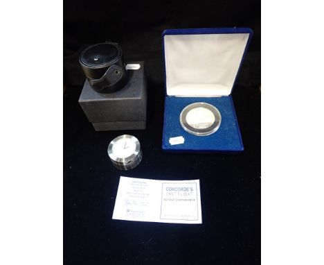 CONCORDE; A 'LAST FLIGHT' COMMEMORATIVE MEDALLION (boxed with certificate) and a Concorde alarm clock, with leather outer cas