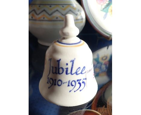 POOLE POTTERY: A COMMEMORATIVE GEORGE V JUBILEE BELL, painted marks, 7.5cm high