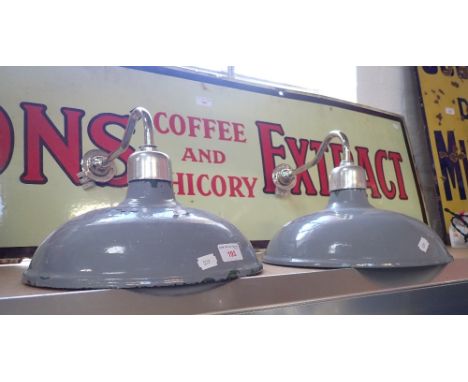 A PAIR OF GREEN ENAMEL WALL LIGHTS (over-painted in grey)