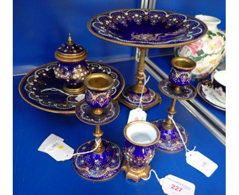 A FRENCH LIMOGES ENAMEL AND GILT-METAL DESK SET, CIRCA 1900 to include a TAZZA, , with 'jewelled' decoration on a cobalt blue