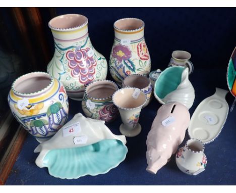 A COLLECTION OF POOLE POTTERY TRADITIONAL WARES, two conch shells and a pig money box