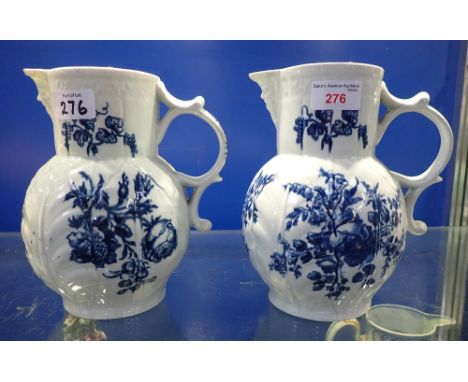 A FIRST PERIOD WORCESTER BLUE AND WHITE JUG, 21cm high and another similar (some chips)
