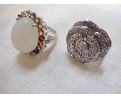 A DIAMOND SET RING IN THE FORM OF A FLOWER, together with one other gem set ring, one ring size O the other ring size K