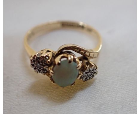 AN OPAL AND DIAMOND RING, on an 18ct yellow gold shank, ring size M