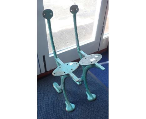 A PAIR OF VINTAGE CAST IRON GARDEN BENCH ENDS