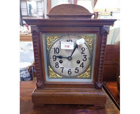 AN EDWARDIAN OAK CASED MANTEL CLOCK
