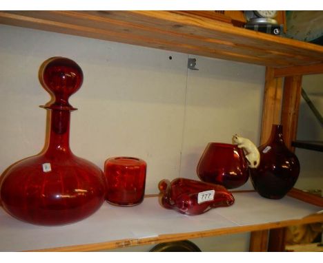 A mixed lot of ruby glass including art glass ashtray, brandy glass with cat and mouse etc.,