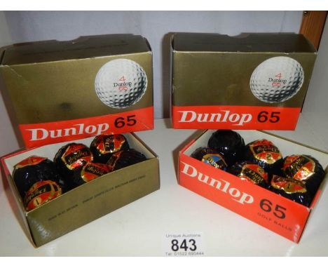 Two boxes of Dunlop golf balls, unused.