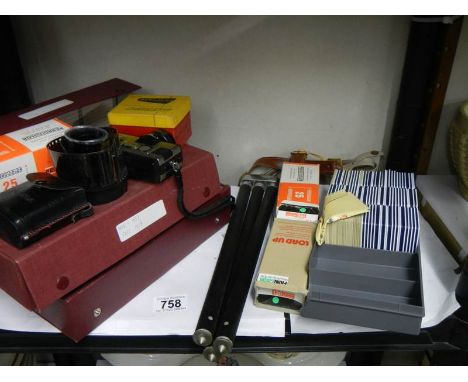A Fujica 350 zoom 110 camera, a camera tripod and a quantity of 35mm slides.