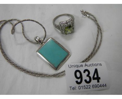 A silver 925 pendant and a costume ring.
