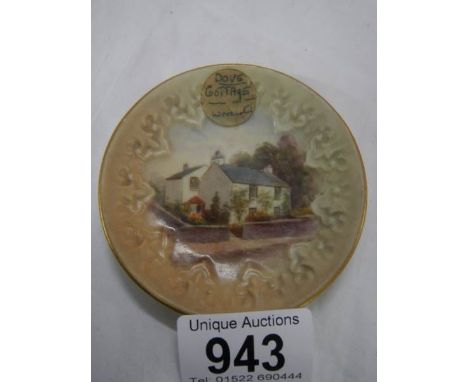 A small early Royal Worcester 'Dove Cottage Grasmere' hand painted plate, 8.25 cm diameter.