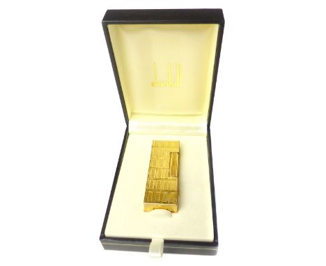 Dunhill Rollagas lighter, with a rectangular engine turned body, in original retail box with papers 