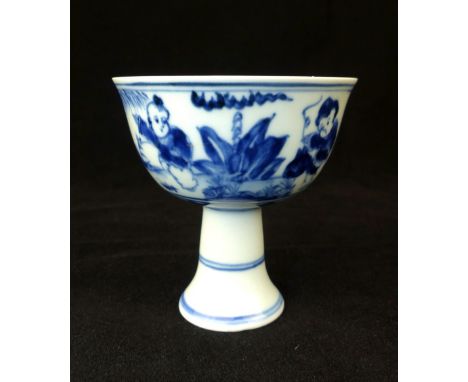 Chinese toasting cup, blue and white glaze, central sun with character marks, outer with bats and children playing, 8.2cm dia