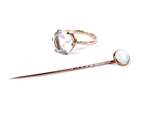 A white topaz solitaire dress ring, in yellow gold, stamped indistinctly, likely "18ct", size P 1/2, 4.5g gross; and an opal 