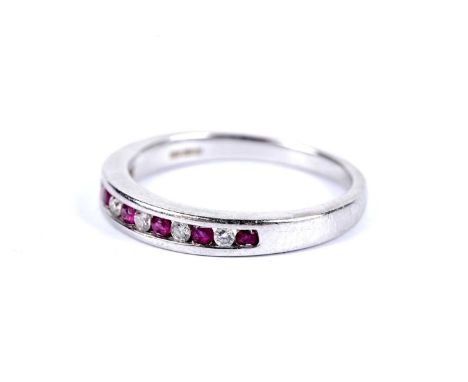A ruby and diamond half hoop eternity ring, in 9ct white gold, size M 1/2, 2.8g gross.