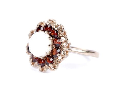 An opal and garnet cluster ring, in 9ct yellow gold, size O, 3.3g gross.