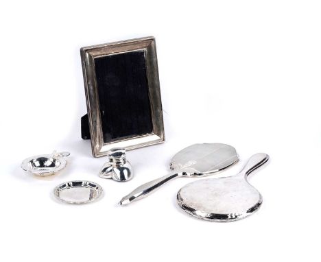 A selection of silverware, including: an Edwardian silver heart form inkwell, by William Devenport, Birmingham 1906, base loa