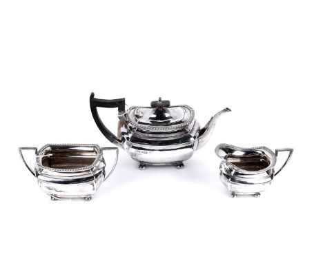 A George V silver three-piece tea service, by Walker &amp; Hall, Sheffield, 1920, comprising teapot, cream jug and sugar bowl