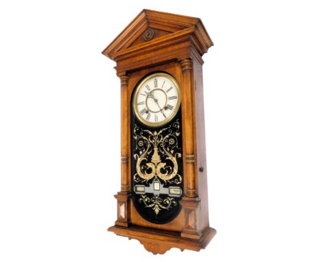 A late 19thC calendar wall clock, probably American, circular dial with chapter ring bearing Roman numerals, eight day moveme