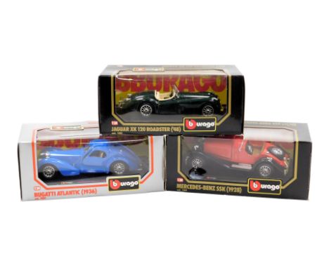 Three Burago diecast motorcars, scale 1:24, boxed, comprising Bugatti Atlantic (1936), Mercedes Benz SSk (1928), and a Jaguar