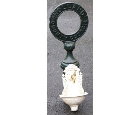 A mid century Holland County Council cast iron column sign, of circular form, painted green, 87cm high, together with a Victo