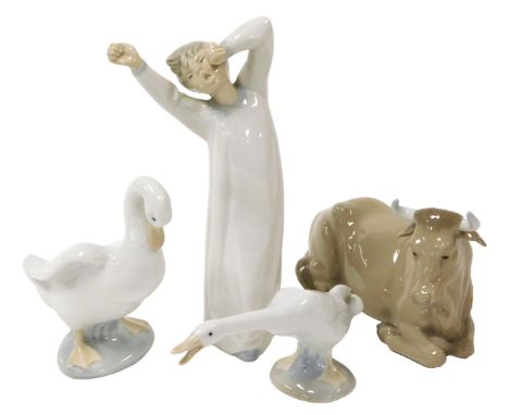 A Lladro porcelain figure of a boy, modelled standing, yawing and stretching, 22cm, together with a Lladro figure of a goose,