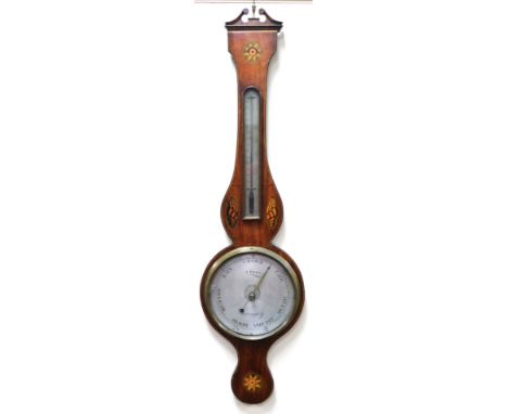 A Georgian mahogany cased wheel barometer, by J Fiora, with a circular silvered dial, and thermometer, the case with shell an