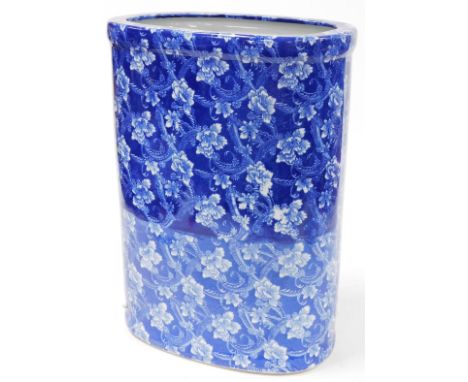 A Chinese Nantucket blue and white porcelain stick stand, decorated in a sheet pattern of flowers, printed mark, 45cm high.