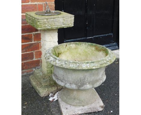 A concrete garden sundial, with a square top, raised on a column of wood form, on a stepped square base, 63cm high, together 