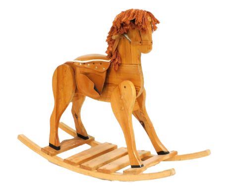 A pine rocking horse, 105cm wide.